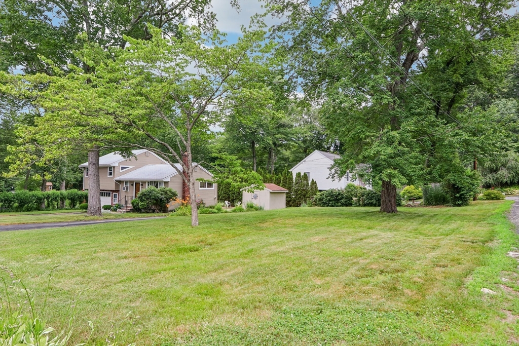 16 Indian Run Road Bellingham, MA 02019 - Photo 24 of 34 a house with a big yard and large trees