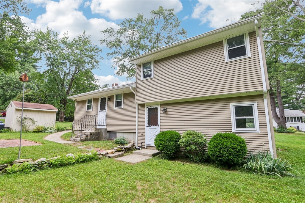16 Indian Run Road Bellingham, MA 02019 - Photo 29 of 34 a view of a house with a yard and plants