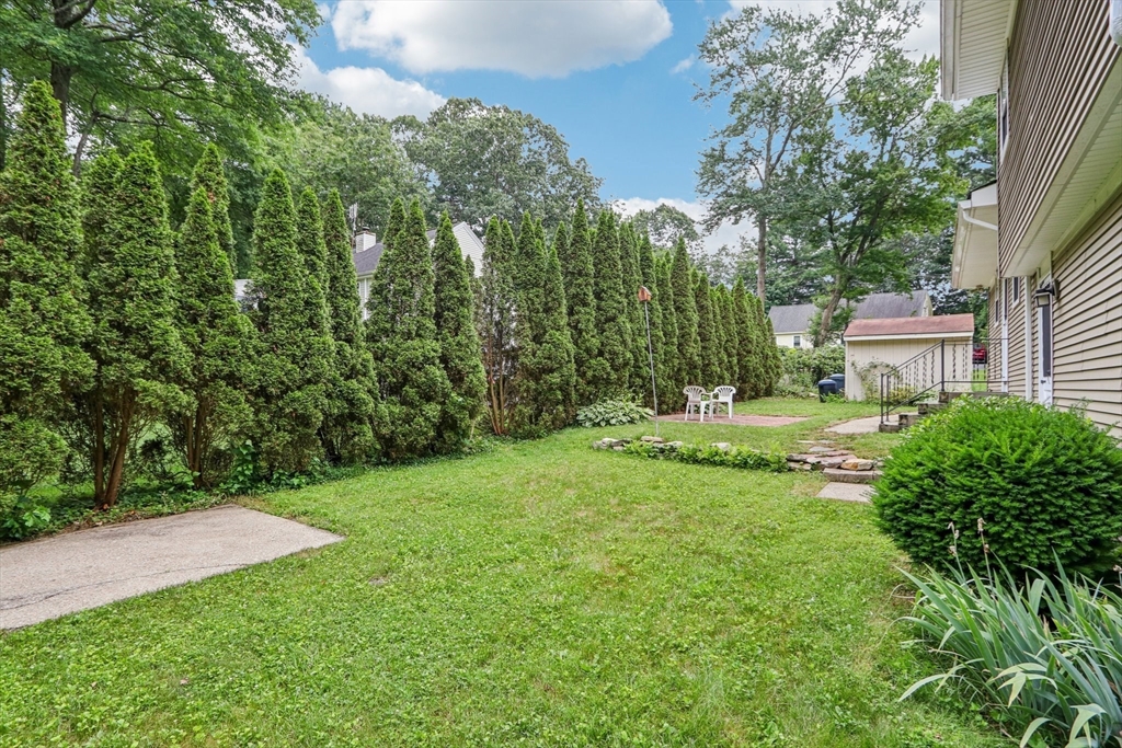 16 Indian Run Road Bellingham, MA 02019 - Photo 30 of 34 a view of a house with a yard and sitting area
