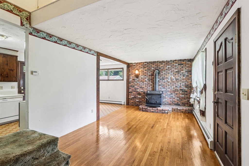 16 Indian Run Road Bellingham, MA 02019 - Photo 7 of 34 a spacious bedroom with a bed and wooden floor