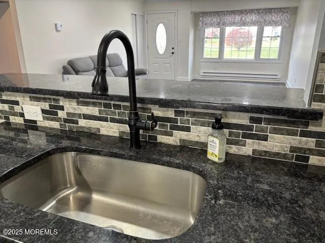 a view of a kitchen with wooden floor