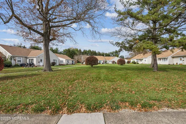 a view of a trees in front of a house