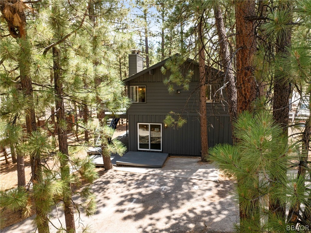 39596 Forest Road Big Bear Lake, CA 92315 - Photo 14 of 50 a front view of a house with a yard and garage