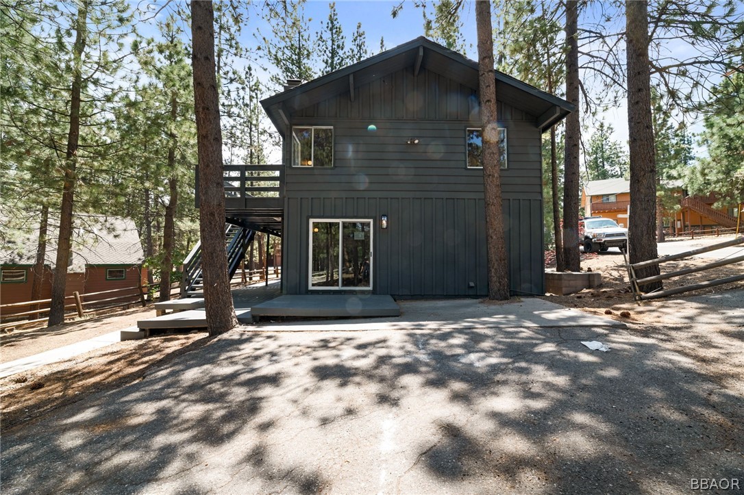 39596 Forest Road Big Bear Lake, CA 92315 - Photo 18 of 50 a front view of a house with a yard