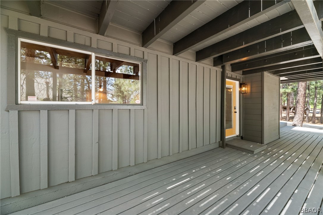 39596 Forest Road Big Bear Lake, CA 92315 - Photo 20 of 50 a view of an empty room with wooden floor and a window