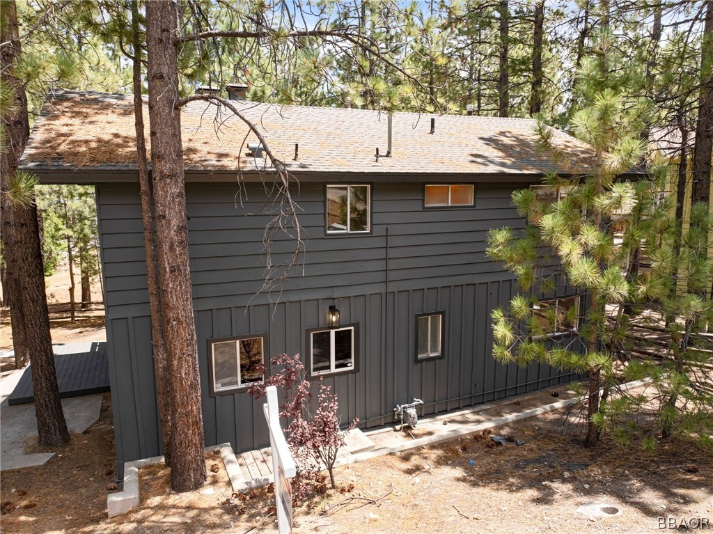 39596 Forest Road Big Bear Lake, CA 92315 - Photo 2 of 50 a view of a house with a yard covered with snow