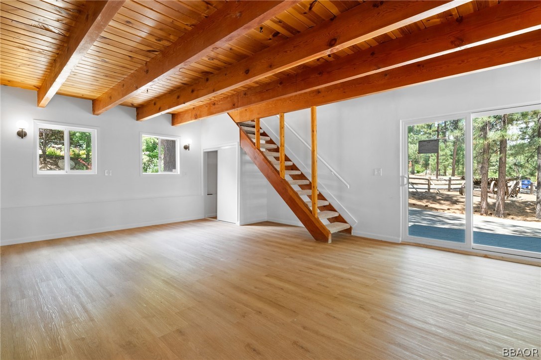 39596 Forest Road Big Bear Lake, CA 92315 - Photo 21 of 50 a view of an empty room with wooden floor and a window