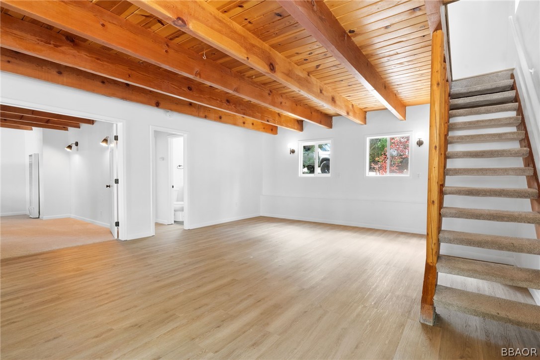 39596 Forest Road Big Bear Lake, CA 92315 - Photo 22 of 50 a view of an empty room with wooden floor and windows