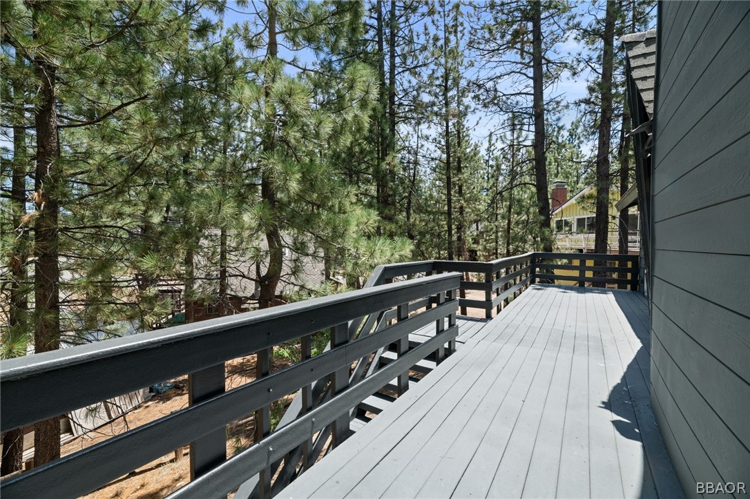 39596 Forest Road Big Bear Lake, CA 92315 - Photo 45 of 50 a view of balcony with wooden floor and fence