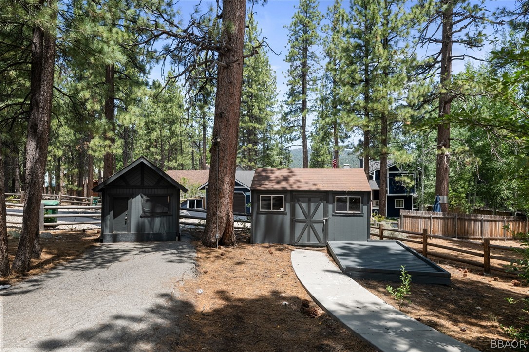 39596 Forest Road Big Bear Lake, CA 92315 - Photo 50 of 50 a front view of a house with a yard garage and a patio