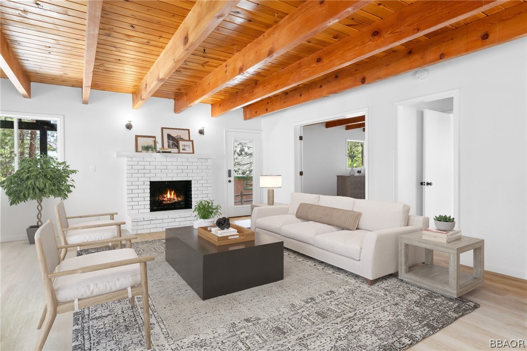 39596 Forest Road Big Bear Lake, CA 92315 - Photo 7 of 50 a living room with furniture and a fireplace