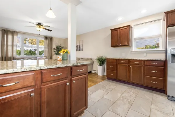 a kitchen with stainless steel appliances granite countertop a sink and cabinets