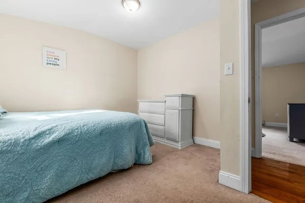a bedroom with a bed and a view of bathroom