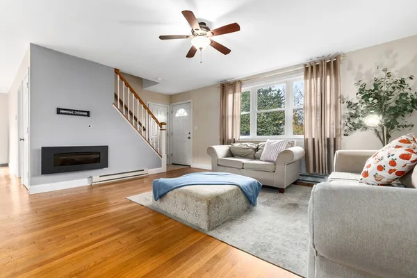 a living room with furniture and a fireplace