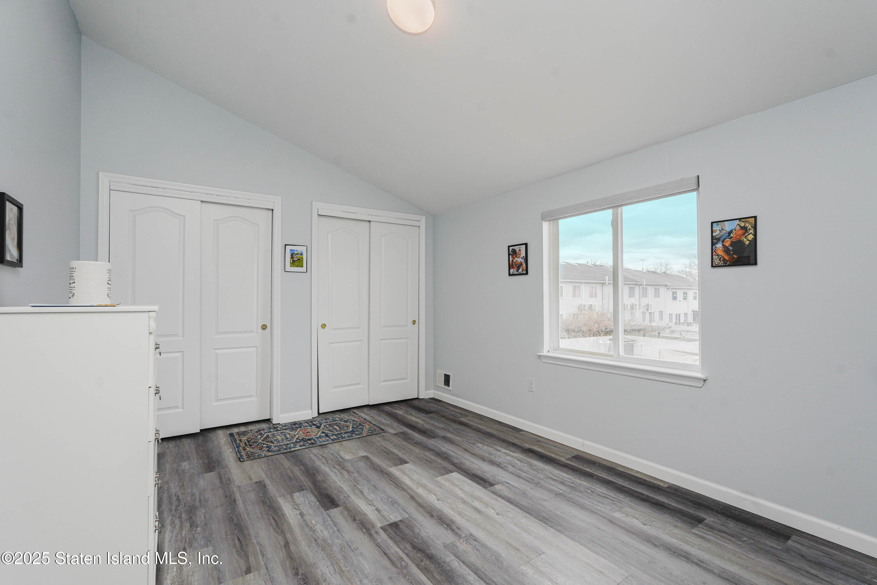 119 Glenn Road Staten Island, NY 10314 - Photo 15 of 26 a view of empty room with wooden floor and fan