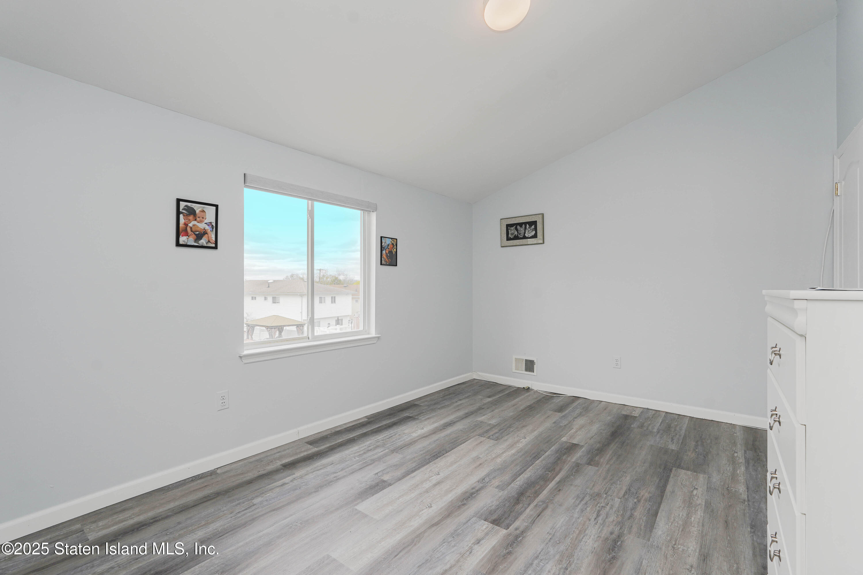 119 Glenn Road Staten Island, NY 10314 - Photo 16 of 26 a view of a room that has a window in it