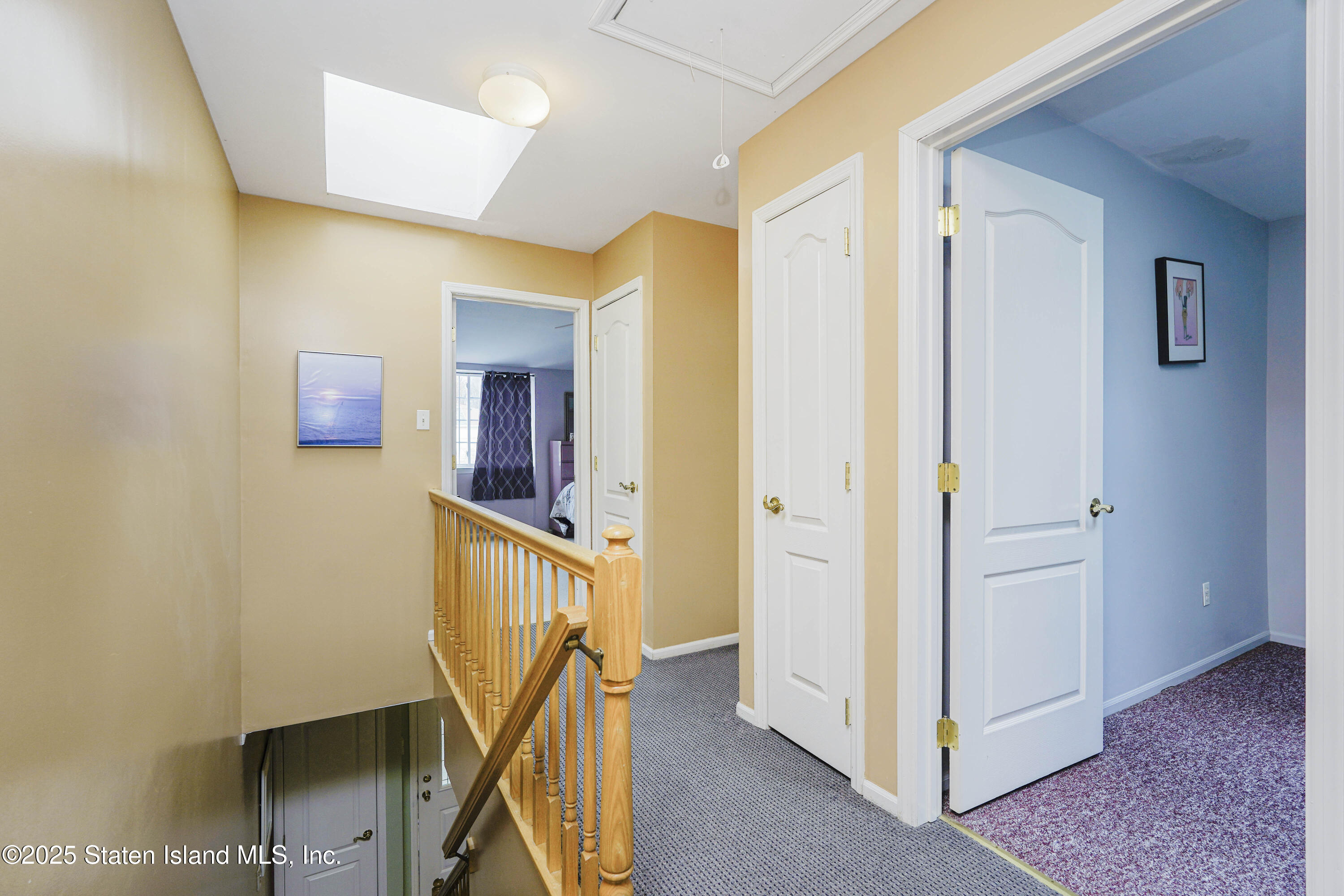 119 Glenn Road Staten Island, NY 10314 - Photo 18 of 26 a view of a hallway with staircase