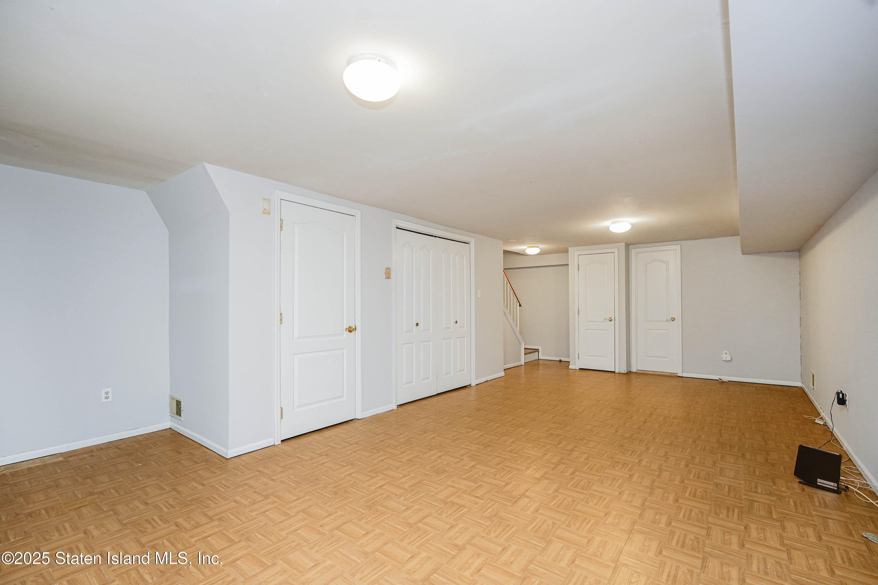 119 Glenn Road Staten Island, NY 10314 - Photo 22 of 26 a view of a room with a bed