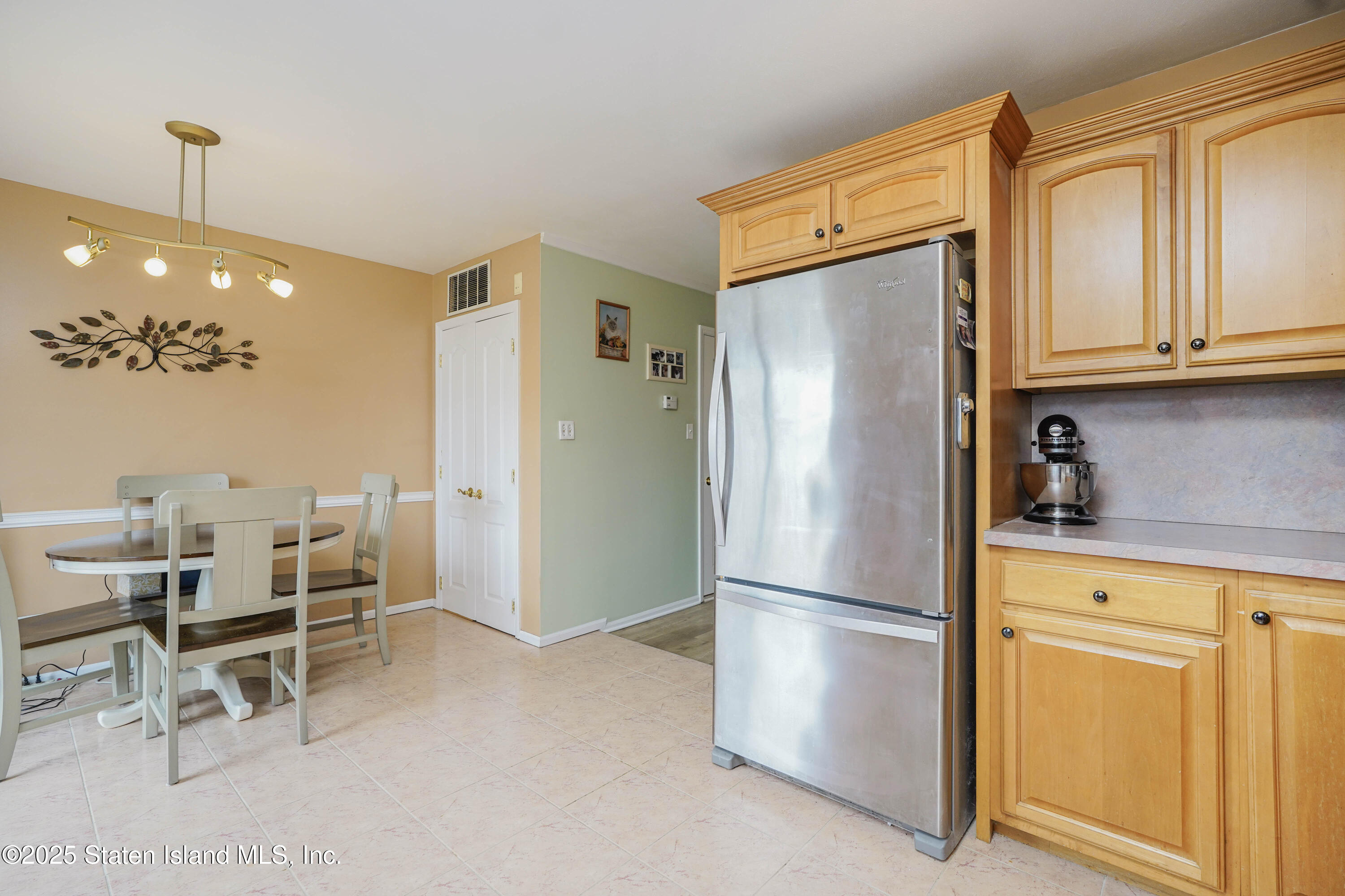 119 Glenn Road Staten Island, NY 10314 - Photo 8 of 26 a kitchen with stainless steel appliances granite countertop a refrigerator and cabinets