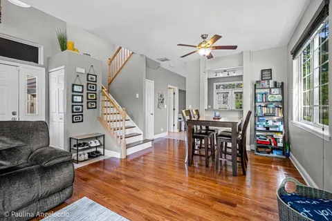 a view of a dining room with furniture and wooden floor