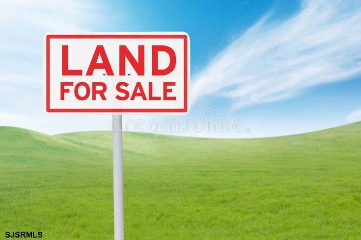 a sign broad in the middle of a field