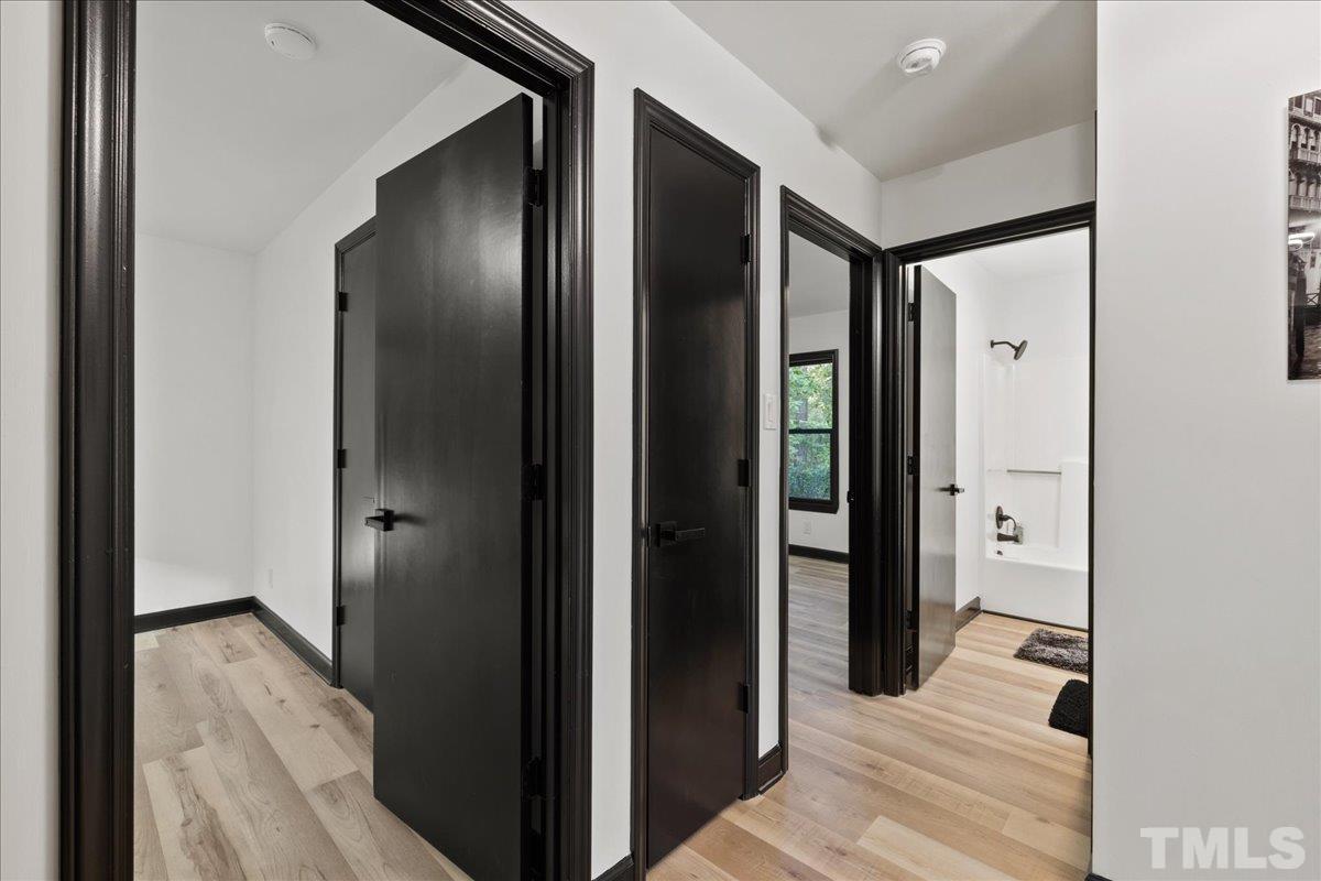 5816 Shannas Way Durham, NC 27713 - Photo 13 of 40 a view of a bathroom from the hallway