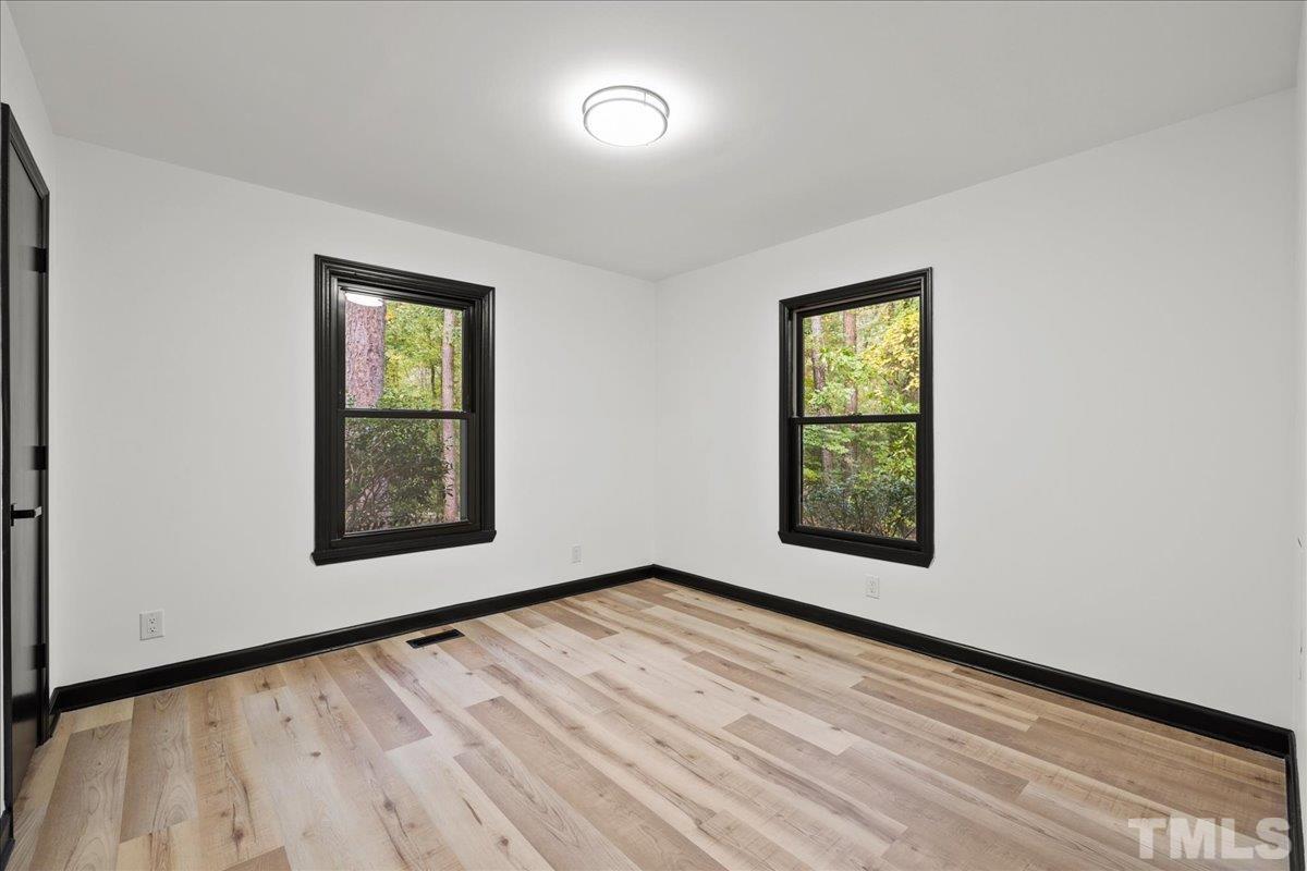5816 Shannas Way Durham, NC 27713 - Photo 15 of 40 an empty room with windows