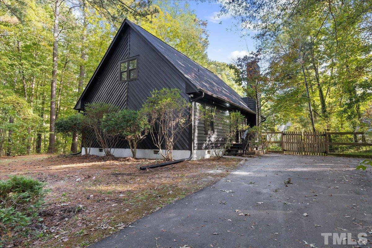 5816 Shannas Way Durham, NC 27713 - Photo 2 of 40 a view of a house with backyard and sitting area