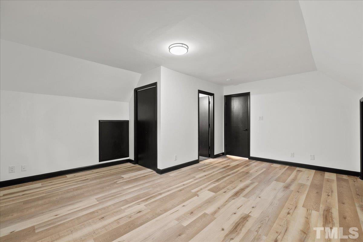 5816 Shannas Way Durham, NC 27713 - Photo 25 of 40 a view of an empty room with wooden floor