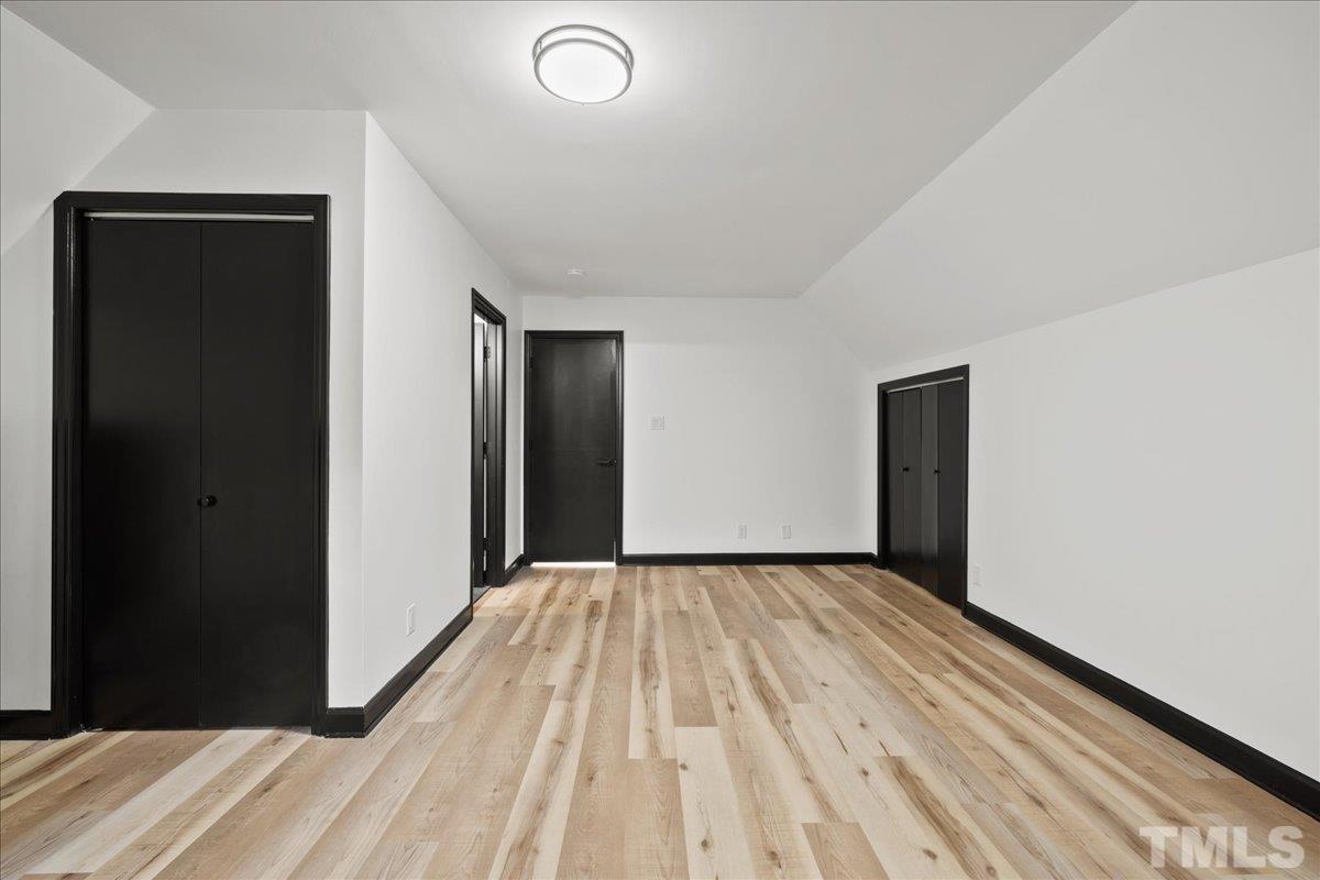 5816 Shannas Way Durham, NC 27713 - Photo 26 of 40 a view of a room with wooden floor