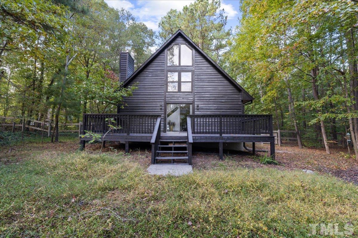 5816 Shannas Way Durham, NC 27713 - Photo 35 of 40 a view of a house with a yard and sitting area