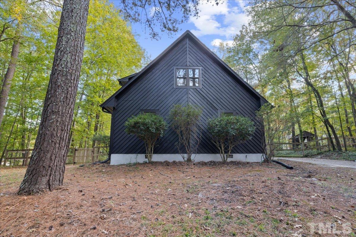 5816 Shannas Way Durham, NC 27713 - Photo 38 of 40 a view of a house with a tree in the yard