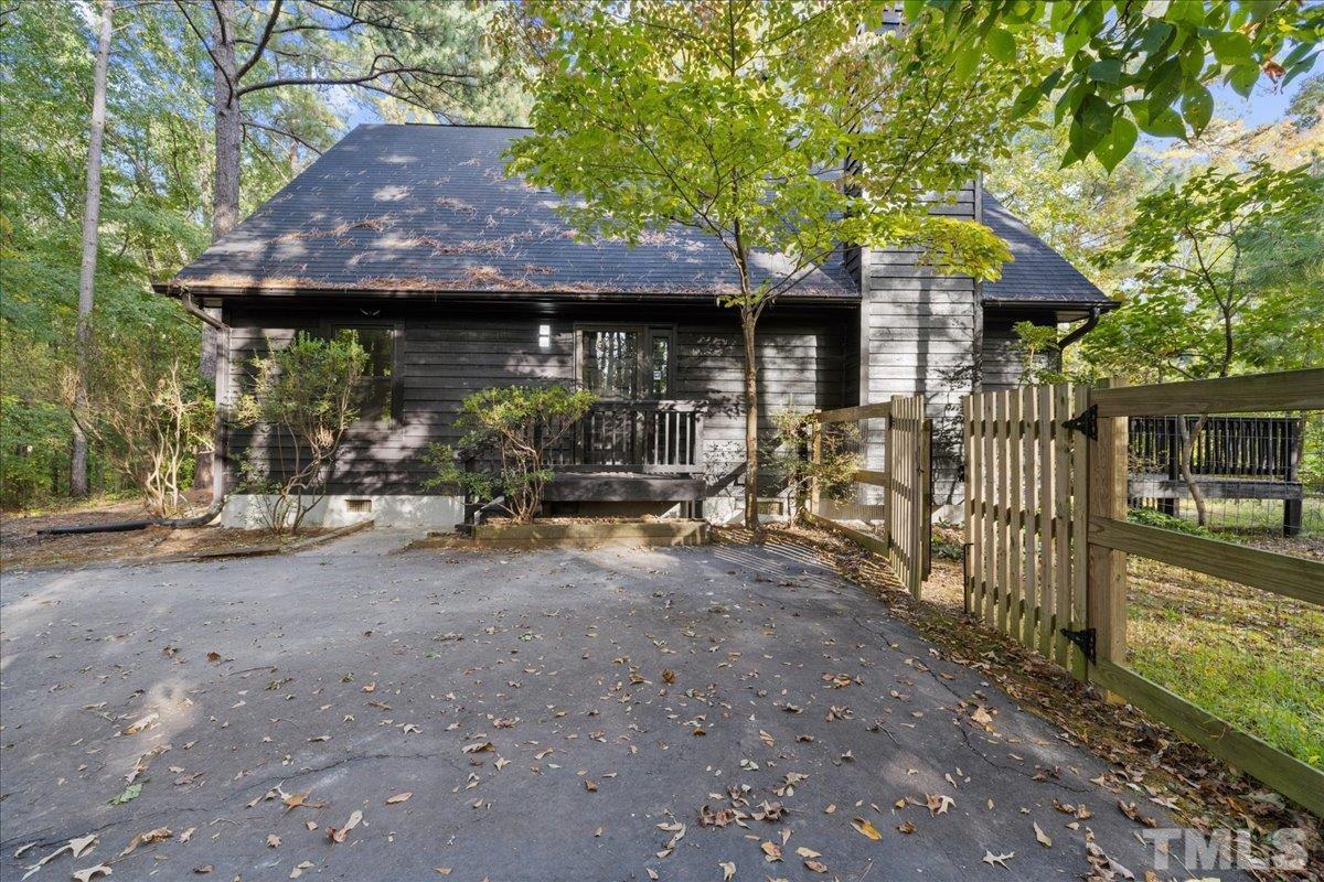5816 Shannas Way Durham, NC 27713 - Photo 40 of 40 a view of a house with a small yard and a large tree