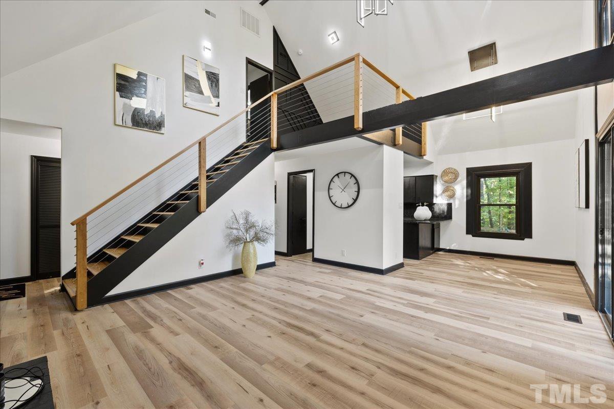 5816 Shannas Way Durham, NC 27713 - Photo 7 of 40 a view of an entryway with wooden floor