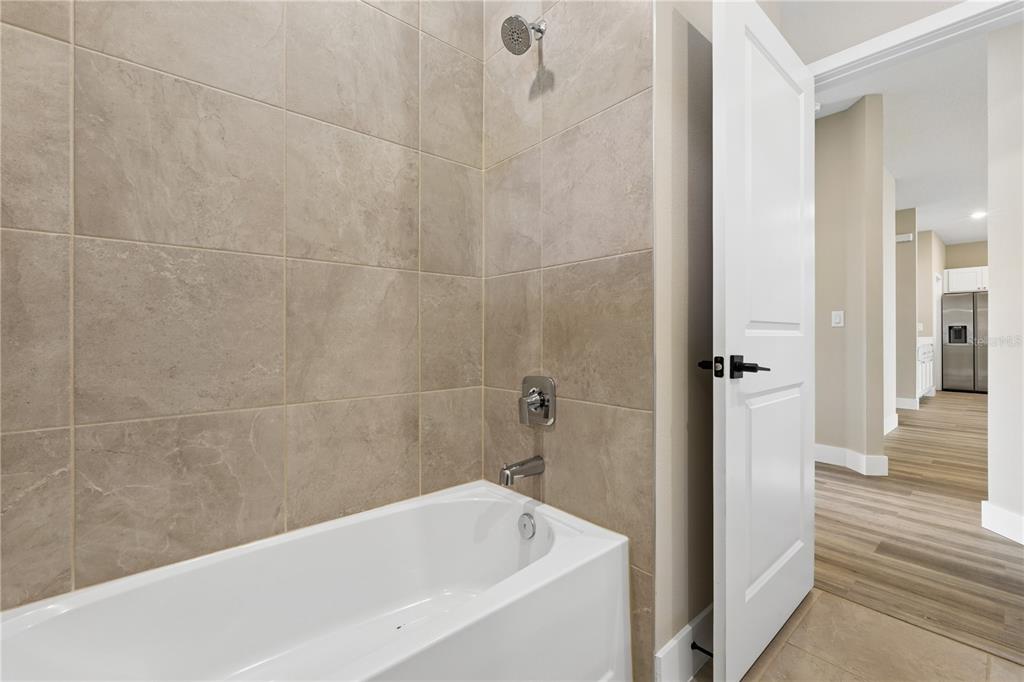 21 Postman Lane Palm Coast, FL 32164 - Photo 8 of 13 a bathroom with a bathtub