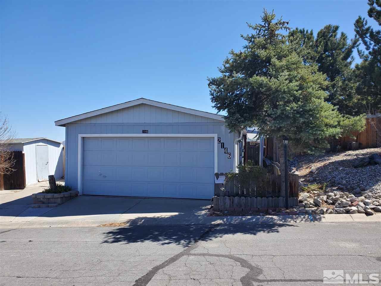 2146 Barberry Way Reno, NV 89512 - Photo 1 of 18 a front view of a house with a yard