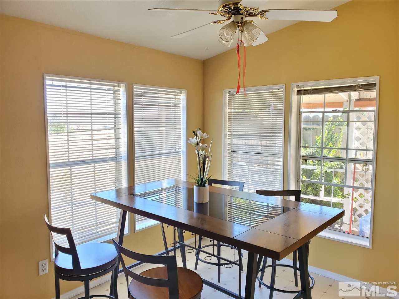 2146 Barberry Way Reno, NV 89512 - Photo 4 of 18 a view of a dining room with furniture and window