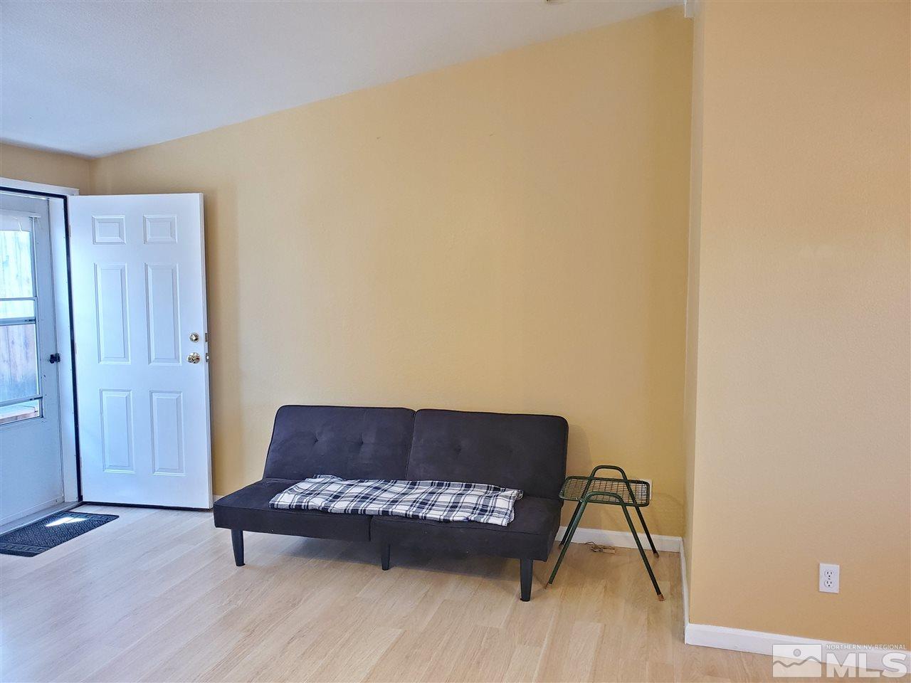 2146 Barberry Way Reno, NV 89512 - Photo 5 of 18 a living room with a couch and wooden floor