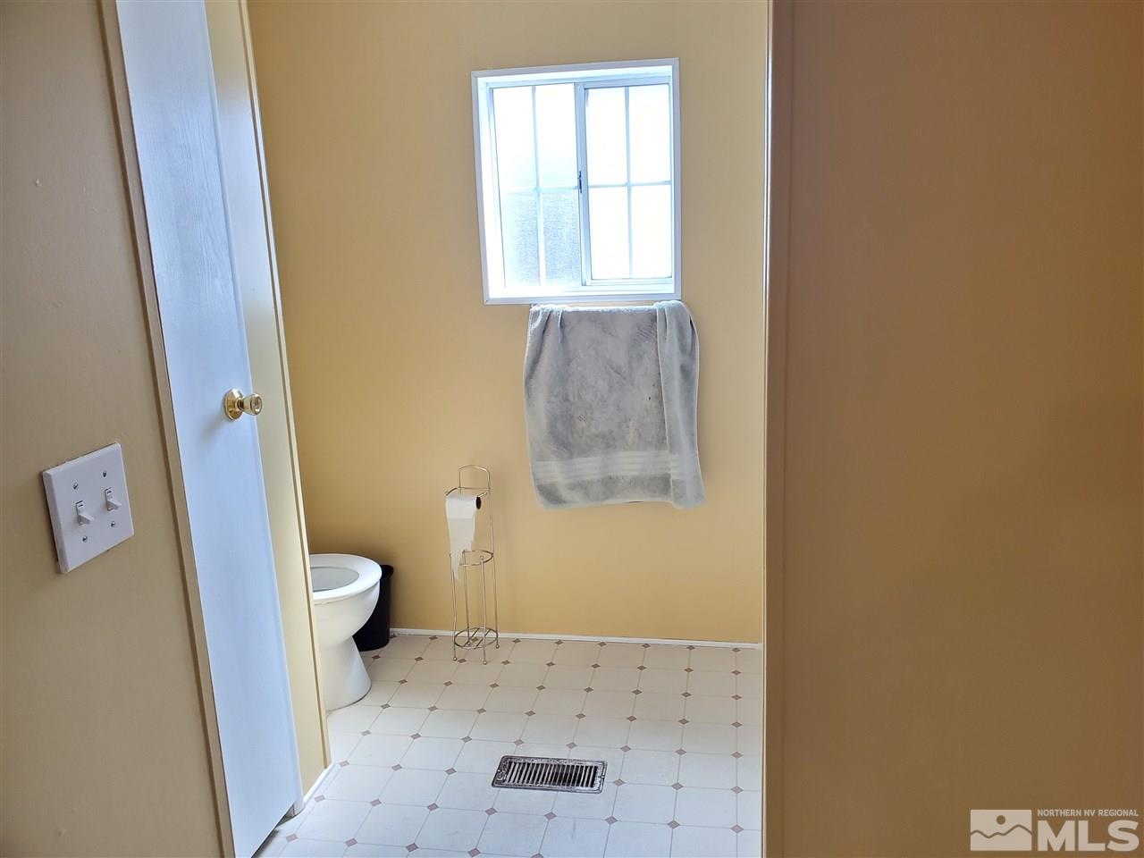2146 Barberry Way Reno, NV 89512 - Photo 10 of 18 a bathroom with a toilet and a shower