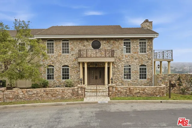 a view of a city with lush green forest