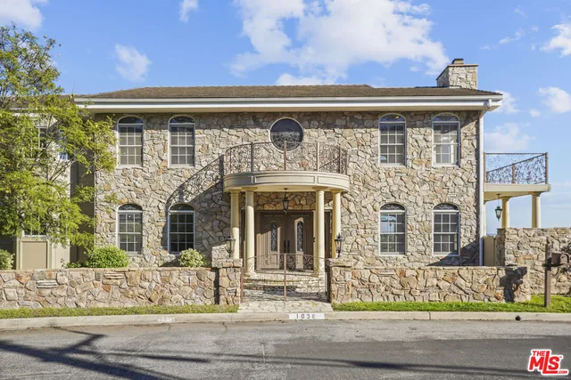 front view of a house with a bench