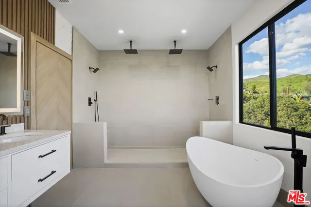 a bathroom with a bathtub and a sink