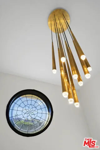 a view of staircase with wooden floor and white walls