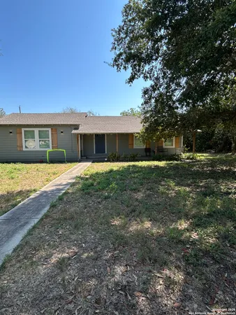 a view of a house with a yard
