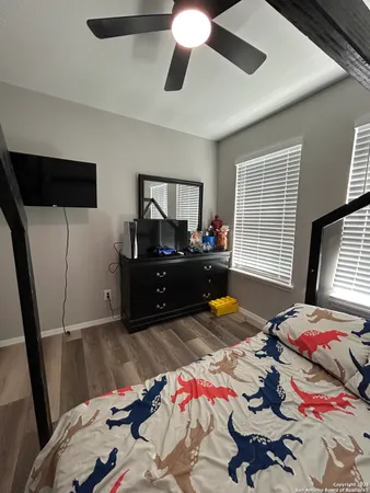 a bedroom with bed and a window