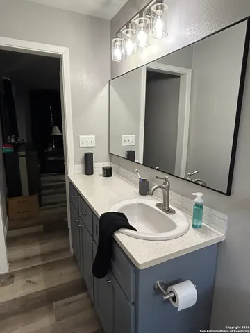 a bathroom with a sink and a mirror