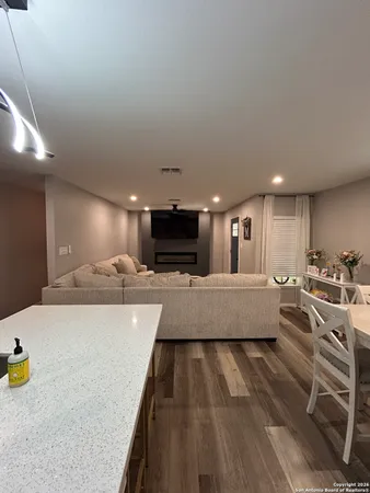 a large white kitchen with a large window