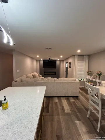 a large white kitchen with a large window