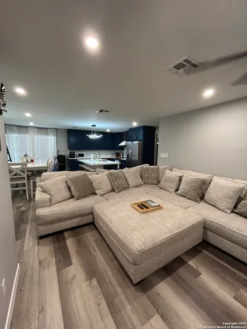 a living room with furniture and a table