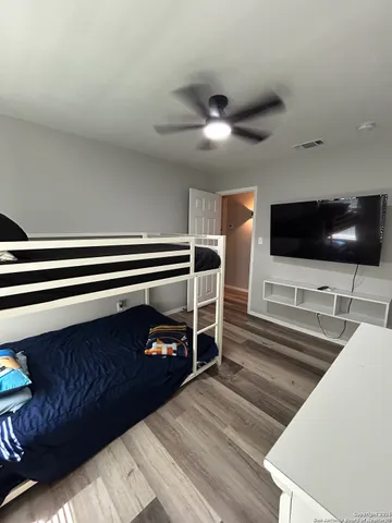a view of a livingroom with furniture and flat screen tv